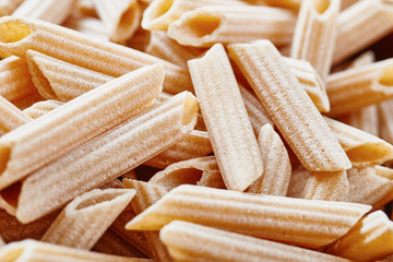Raw pasta macaroni close up