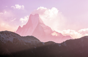 Grandiose view of Machapuchare peak (6993 m) at sunrise. Holy peak, sacred abode of God Siva. Nepal, Himalayas.