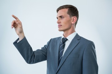 Businessman touching an invisible screen