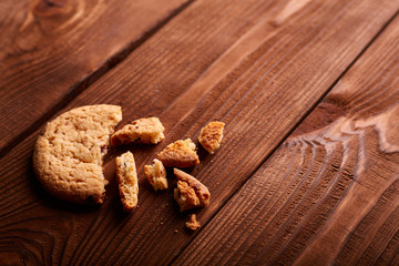 Homemade Chocolate cookies on wooden table. Pile of delicious chip cookies. Christmas cookies. Biscuits. Oat biscuits. Cereal biscuits with the addition of sesame, peanuts, sunflower and amaranth.