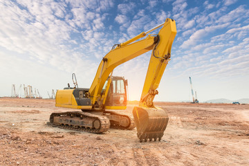 Heavy earth mover with blue sky in the background