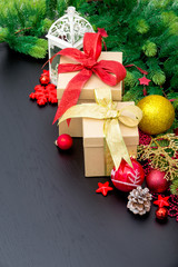 Fototapeta na wymiar Christmas gift box. Christmas presents in red boxes at black woo