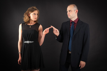 Beautiful couple doing different expressions in different sets of clothes: be careful