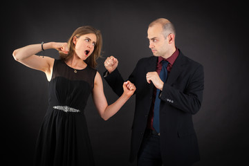 Beautiful couple doing different expressions in different sets of clothes: fight
