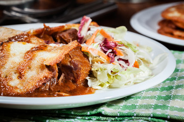Potato pancakes with meat stew served