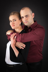 Beautiful couple doing different expressions in different sets of clothes: arms crossed