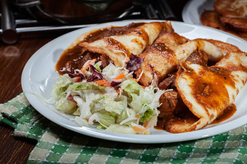 Potato pancakes with meat stew served