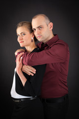 Beautiful couple doing different expressions in different sets of clothes: arms crossed