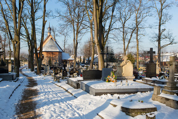 cementery with tombstones and crosses, cemetery in winter landscape
