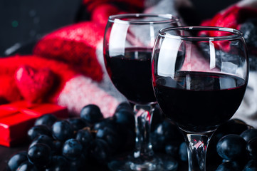 two glasses of red wine, grapes