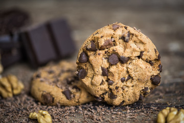Chocolate Chip Cookies and Walnuts on Wooden Rustic Background