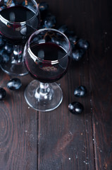Red wine in glasses with grape
