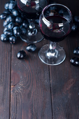 Red wine in glasses with grape