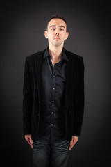 Handsome man doing different expressions in different sets of clothes: at attention