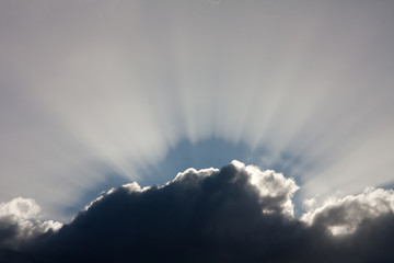 Fototapeta na wymiar dramatic blue sky with clouds and sun rays
