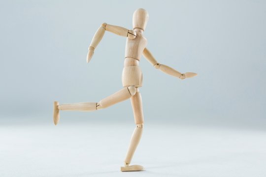 Wooden figurine running