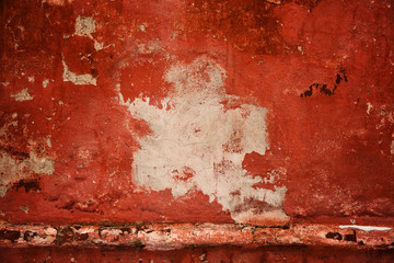 Red old wall. abstract background texture concrete wall. Paint peels from the surface of the wall. Empty space