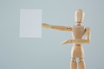 Wooden figurine showing blank placard
