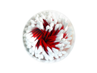 Cotton buds in a round glass on a white background top view