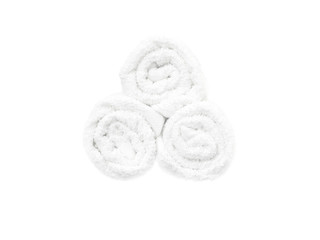 Obraz na płótnie Canvas Stack of bath white rolled towels isolated on white background, top view
