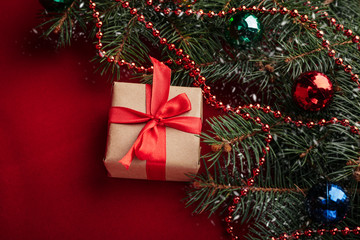 Christmas background with xmas tree and sparkle bokeh lights on wooden canvas background. Merry christmas card. Winter holiday theme. Happy New Year. Space for text. Happy Holidays