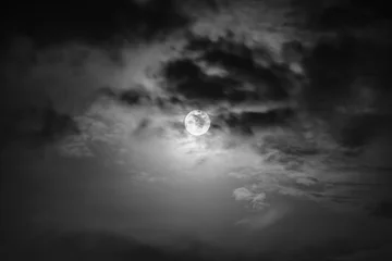 Raamstickers Nighttime sky with clouds and bright full moon with shiny. © kdshutterman