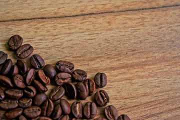 Coffee beans on a wooden table