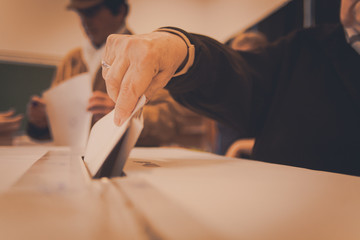 Person voting at polling station