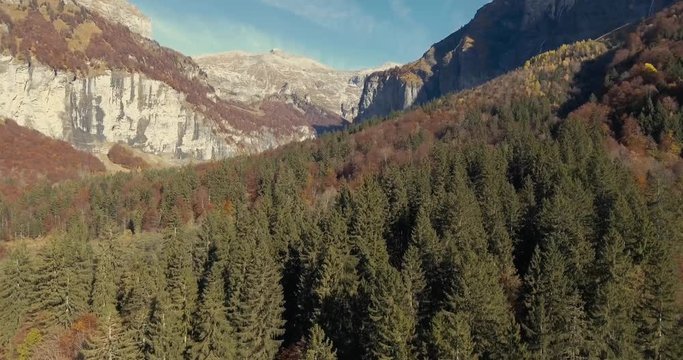 Stunning Drone Views over the alpine forest valley and mountains of Sixt in the High french Rhone alp region of france.