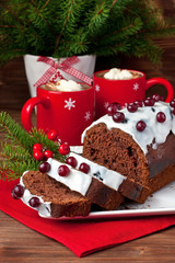 Still life with tasty cake portion and hot chocolate drink in mug