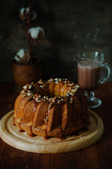 Rustic style carrot bundt cake with salt caramel and walnuts