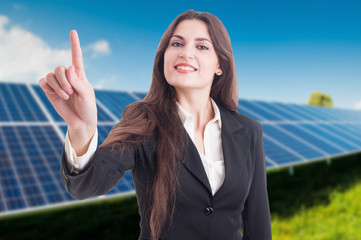 Beautiful business woman presing on invisible screen