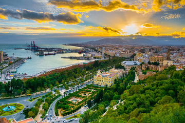 aerial view of malaga taken from gibralfaro castle including port of malaga, alcazaba castle and the cathedral of malaga during sunset - obrazy, fototapety, plakaty