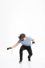 Young handsome man wearing virtual reality device