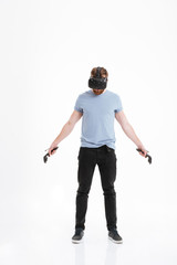 Handsome man wearing virtual reality device