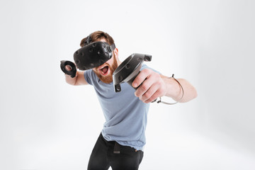 Bearded happy man wearing virtual reality device