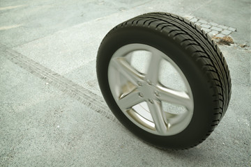 Rollender Autoreifen auf der Straße - 3D Rendering