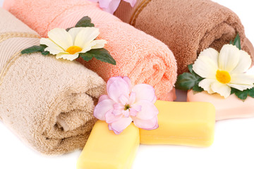 Towel, soaps and flowers