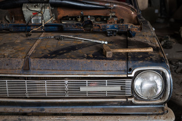 Fototapeta premium Front of the old vintage car in a shop