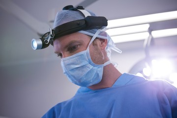 Fototapeta na wymiar Surgeon performing operation in operation room