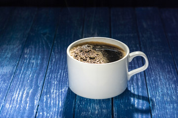 Coffee cup on wooden table.