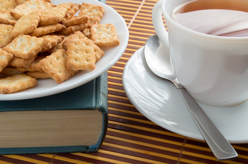 Close-up view on a cup of tea and crackers