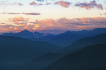 Mountains after sunset with beautiful sky and clouds.