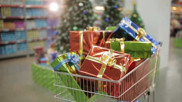 Shopping carts full of Christmas gifts. Christmas and shopping concept