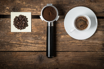 Coffee beans, ground and cup of espresso