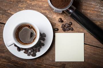 Coffee beans, ground and cup of espresso