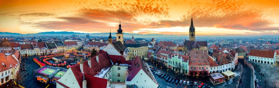 Panoramic view of Sibiu central square in Transylvania, Romania. City also known as Hermannstadt. Sunset HDR hi-resolution photography.