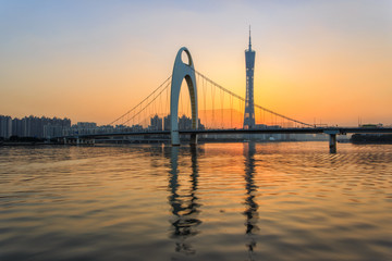 Fototapeta na wymiar Modern bridge in Zhujiang River and modern building of financial