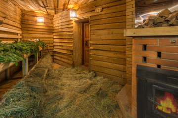 Rustic wood-heated sauna with stove
