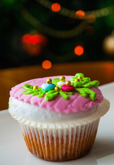 cake on table against the background of Christmas tree